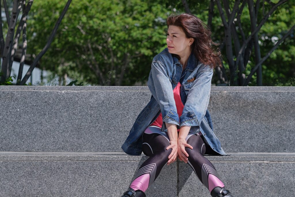 woman with hands holding pressing crotch lower abdomen